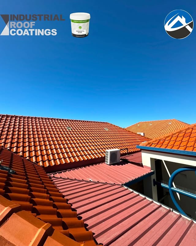 Terracotta tiled roofs under a clear blue sky