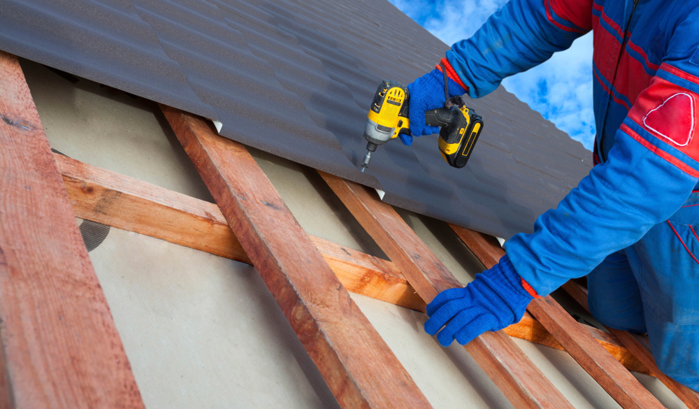 Roof repair work on a Logan tile roof