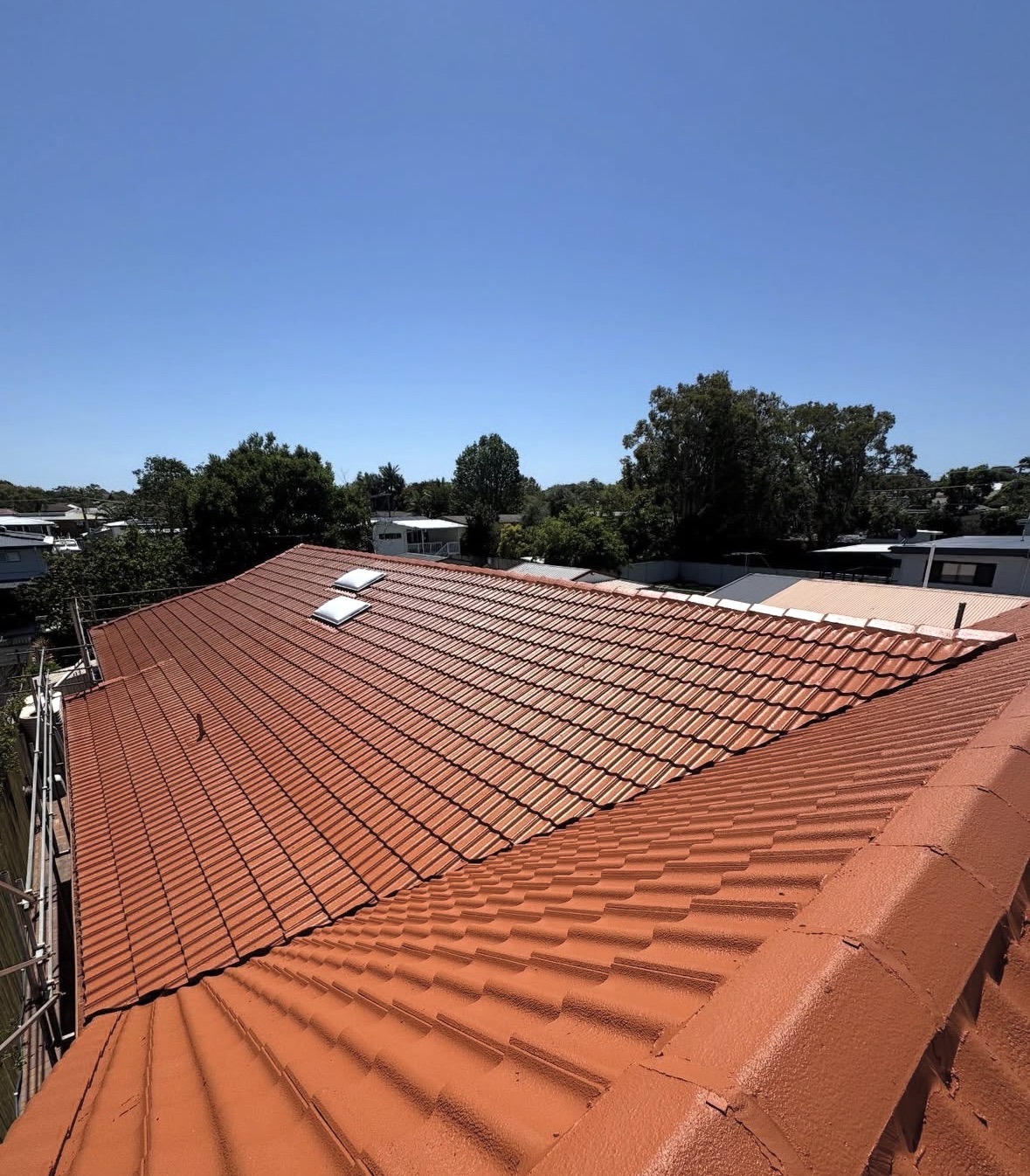 Molendinar home with a freshly restored tile roof by BGT Roofing